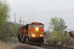 BNSF 7668 heads south with a freight train in tow,